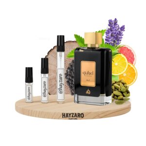 Perfume Lattafa Ejaazi Edp 100ml frasco negro con diseño de rejilla plateada y dorada fragancia ambar aromatica amaderada unisex con citricos cardamomo ambroxan.