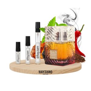 Decant de perfume Lattafa Khamrah Dukhan Eau de Parfum en atomizador. Fragancia especiada, dulce y ahumada con notas de tabaco, pimiento e incienso.
