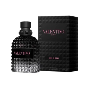 Perfume Valentino Uomo Born in Roma 100ml EdT. Frasco rectangular de vidrio con diseño de tachuelas rockstud transparente con líquido de color ámbar y tapa negra.