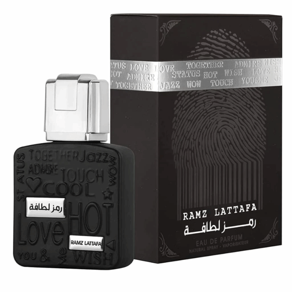 Perfume Lattafa Ramz Lattafa Silver Edp 100ml frasco negro y plateado con diseño de cuerpo masculino fragancia ambar vainilla dulce unisex con pera y cardamomo.